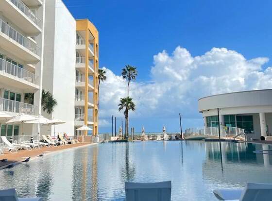 Peninsula Island Resort & Spa - Beach Front Property at South Padre Island allows check-in for 18 year-old guests