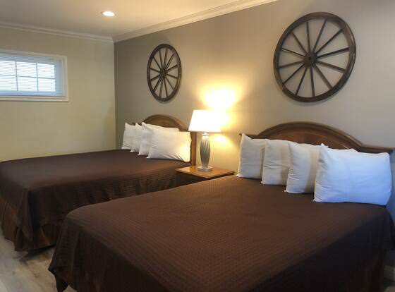 Westward Wagon Inn Theme Park Entrance allows check-in for 18 year-old guests